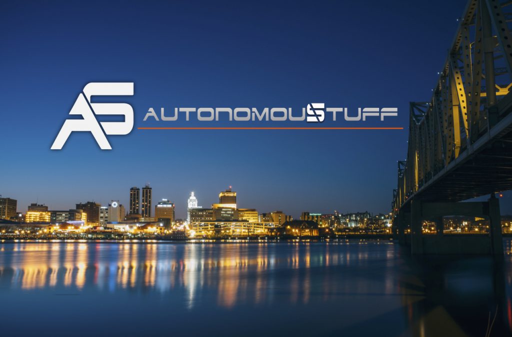 Photo of city skyline with AutonomouStuff logo